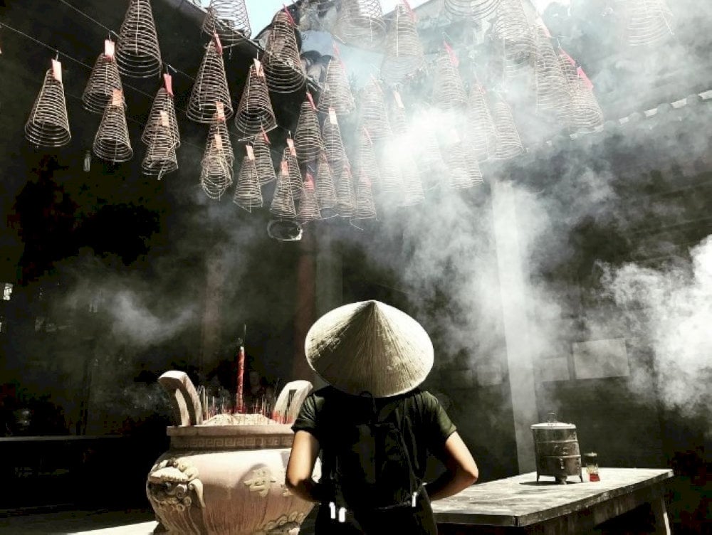 Artistic angles capture incense smoke and filtered light
